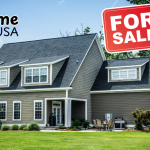 Couple holding keys in front of their new home in the USA.